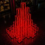 Crimson Pulse contemporary illuminated LED sculpture by FORMA Sculptures, featuring glowing geometric cubes that symbolize energy, connectivity, innovation, and the vibrant rhythm of modern cities.