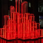 Crimson Pulse contemporary illuminated LED sculpture by FORMA Sculptures, featuring glowing geometric cubes that symbolize energy, connectivity, innovation, and the vibrant rhythm of modern cities.