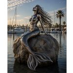 Marina Siren contemporary stainless steel mermaid sculpture by FORMA Sculptures, creating a landmark waterfront public art installation for marinas, luxury resorts, yacht clubs, and coastal developments.