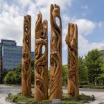 Whispers of the Forest contemporary monumental timber sculpture by FORMA Sculptures, featuring hand-carved organic forms inspired by nature for public art and urban landscapes.